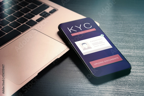 Know your client - KYC form on mobile phone. Application form for uploading documents for client identity and verification. Electronic eKYC fraud risks management, AML anti-money laundering concept photo