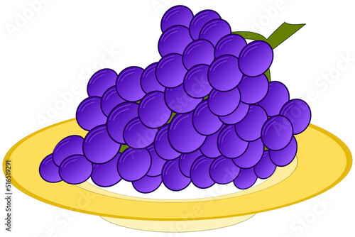 The grape wine with purple berries on a yellow plate