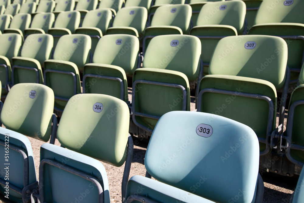 Obraz premium Empty Plastic Chairs at the Stadium