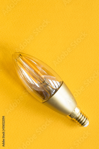 Light bulb on yellow photo