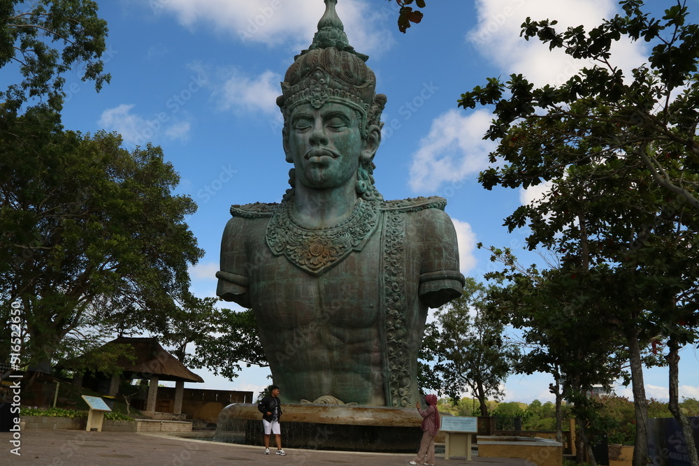 Garuda Wisnu Kencana Cultural Park (GWK). A popular place that has a statue as high as 122 meters, is called the GWK Statue. (Bali, Indonesia - June 18, 2022) Garuda Wisnu Kencana Cultural Park (GWK). A popular place that has a statue as high as 122 meters, is called the GWK Statue. (Bali, Indonesia - June 18, 2022)