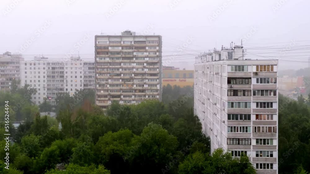 Heavy rain and thunderstorm in Moscow, Russia - Shot of residential living quarter in heavy rain and old soviet buildings - july 2022 Heavy rain and thunderstorm in Moscow, Russia - Shot of residential living quarter in heavy rain and old soviet buildings - july 2022