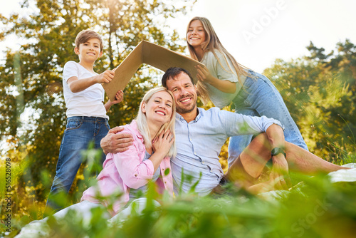 Parents and children in the park with a roof over their heads