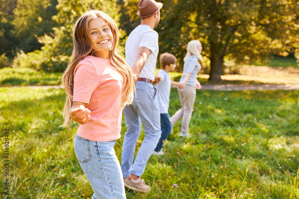 Girl holding hands with family while running Girl holding hands with family while running