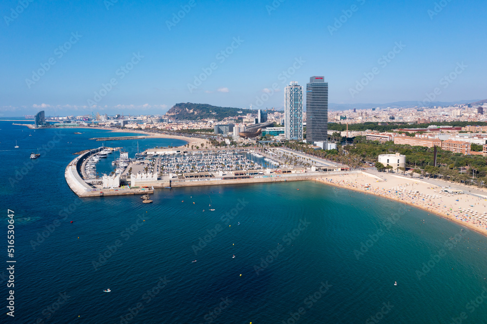 BARCELONA, SPAIN - JUNE 24, 2021: Drone view of the Port Olympic in the Mediterranean Sea