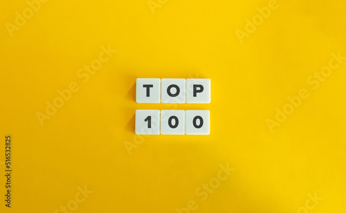 TOP 100 Banner. Text on Block Letter Tiles on Orange Yellow Background. Minimal Aesthetics.