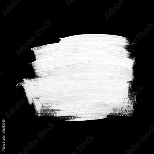 White brush painted acrylic isolated on black background. Image.