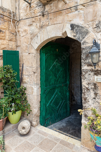 Large  wooden massive carved front door in a residential building in the Arab Christian village Miilya  in the Galilee  in northern Israel