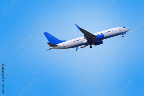 Passenger plane against the blue sky.