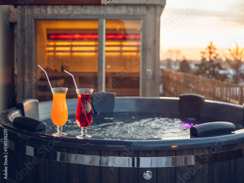 Obraz na płótnie Hot outdoor wooden bath tub on terrace of private house