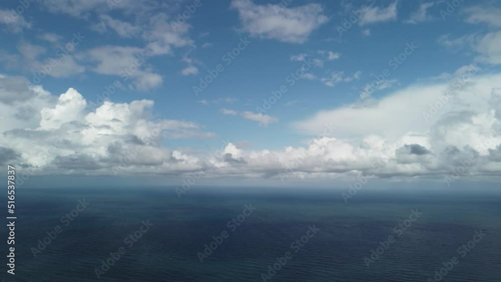 Abstract aerial nature summer ocean sunset sea and sky background. Small waves on clear water surface in motion blur with bokeh lights from sunrise. Holiday, vacation and recreational concept Abstract aerial nature summer ocean sunset sea and sky background. Small waves on clear water surface in motion blur with bokeh lights from sunrise. Holiday, vacation and recreational concept