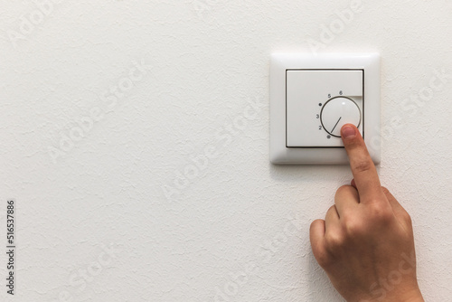 Thermostat for Regulation Temperature. Regulator the Temperature at home with the heating thermostat to Save Energy, Close up. Copy space.   photo