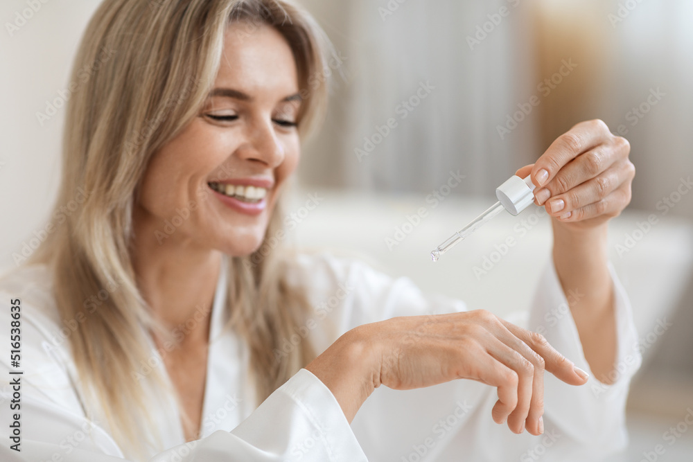Positive blonde lady testing brand new beauty product Positive blonde lady testing brand new beauty product