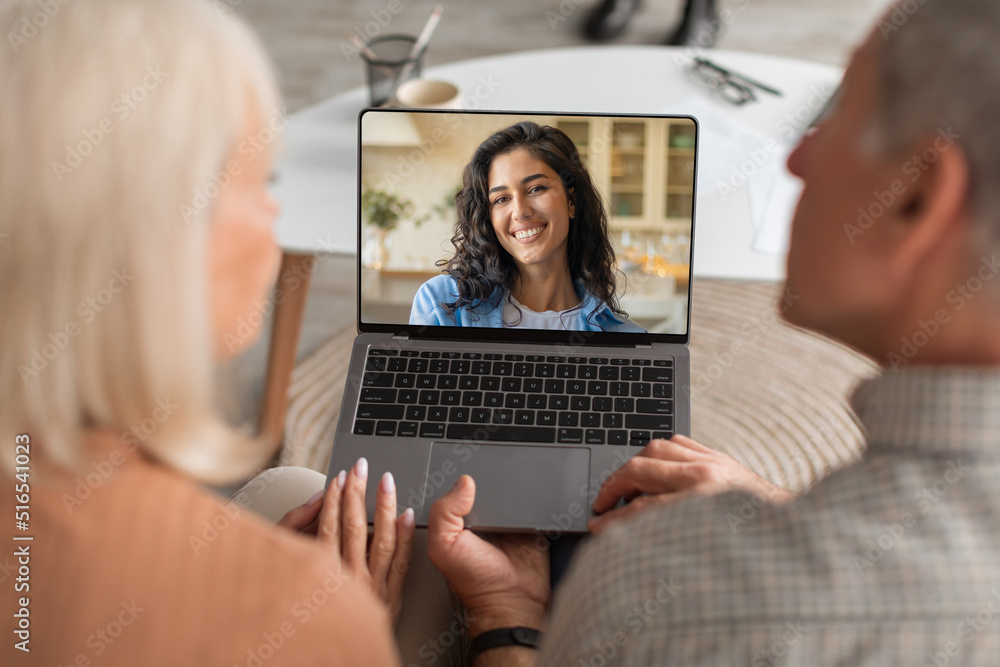 Senior Parents Making Video Call To Their Daughter On Laptop Senior Parents Making Video Call To Their Daughter On Laptop
