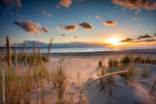 Fototapeta Naklejka Na Ścianę i Meble -  Beautiful sunset on the beach of the Sobieszewo Island at the Baltic Sea. Poland