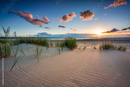 Fototapeta Naklejka Na Ścianę i Meble -  Beautiful sunset on the beach of the Sobieszewo Island at the Baltic Sea. Poland