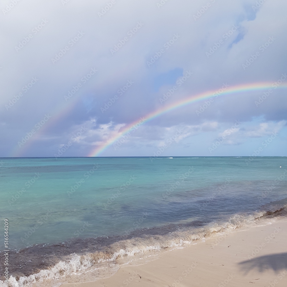 Rainbow over the Caribbean Sea off the coast of Saona Island of the Dominican Republic Rainbow over the Caribbean Sea off the coast of Saona Island of the Dominican Republic