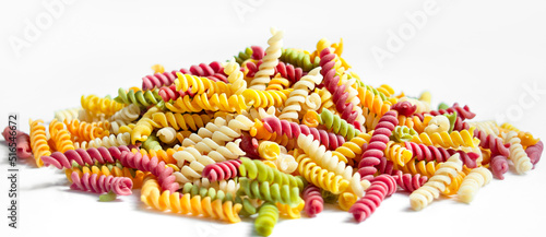 Colored Italian pasta on a white background. Children's paste with natural dyes from vegetables and herbs. Pasta background.Banner.