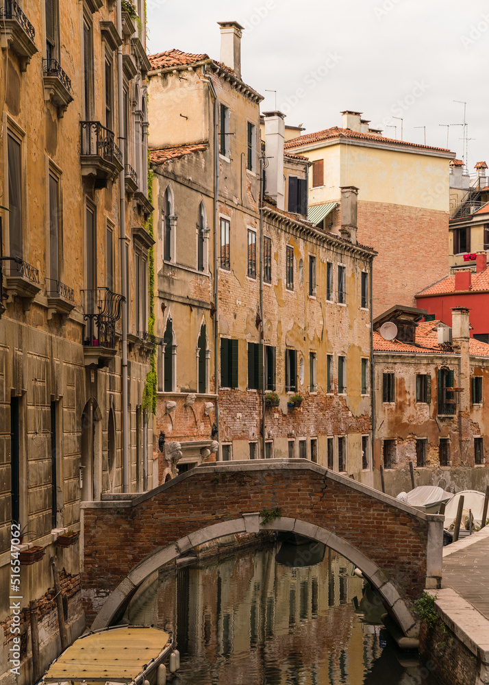 Canal and bridge with typical architecture in Venice, Italy 