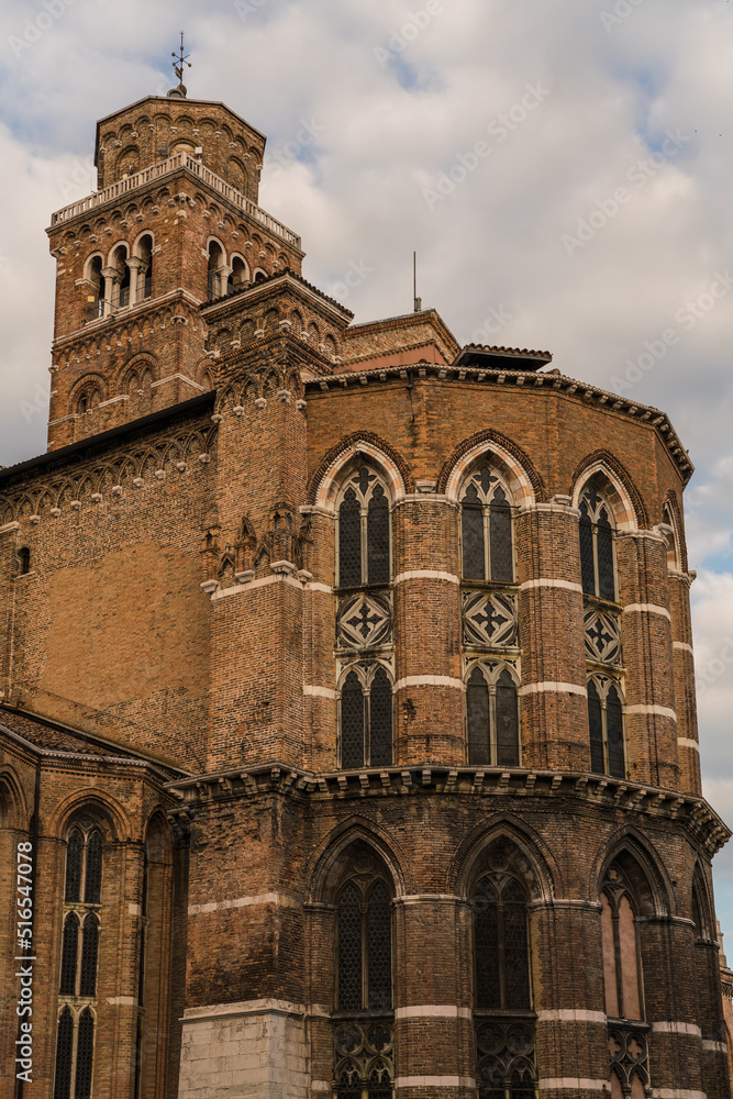 detail of a brick church with Venetian gothic style and windows in Venice, Italy 
