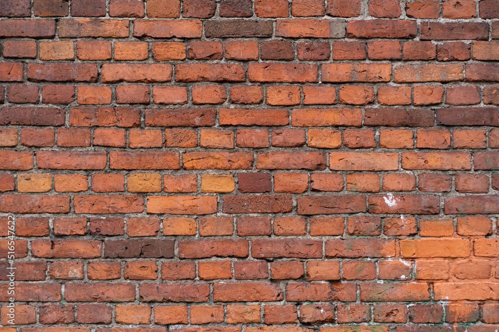 Fototapeta premium Empty brick red wall. background of a old brick house.