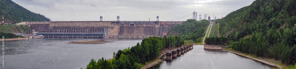 Dam of a hydroelectric power station. Industrial landscape.