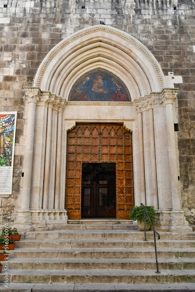 The entrance door into a medieval church in Sulmona, an Italian village in the Abruzzo region.