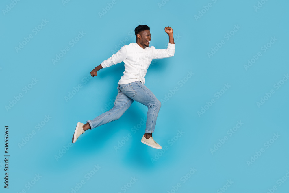 Full body portrait of excited person hurry rush look empty space isolated on blue color background