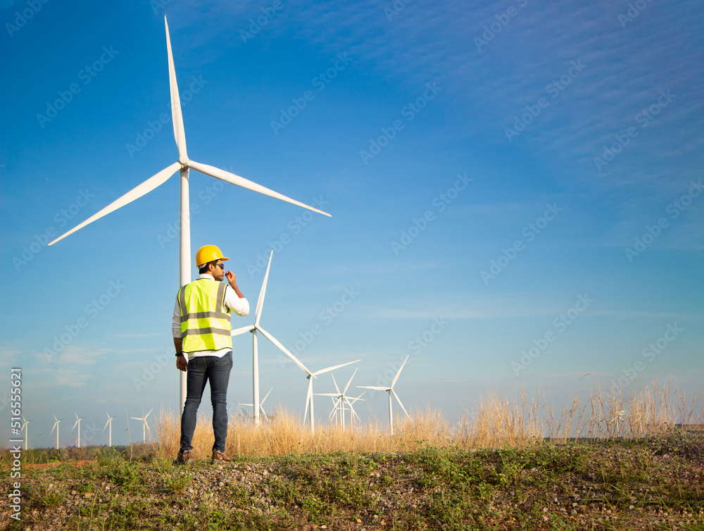 custom made wallpaper toronto digitalengineer team working in wind turbine farm. Renewable energy with wind generator by alternative energy concept.