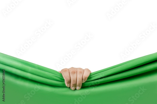 Human hand opening green curtain