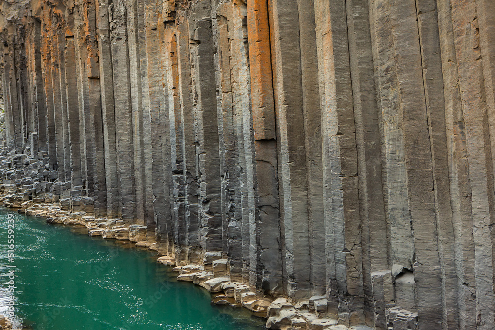 canyon with basalt columns and crystal clear water canyon with basalt columns and crystal clear water
