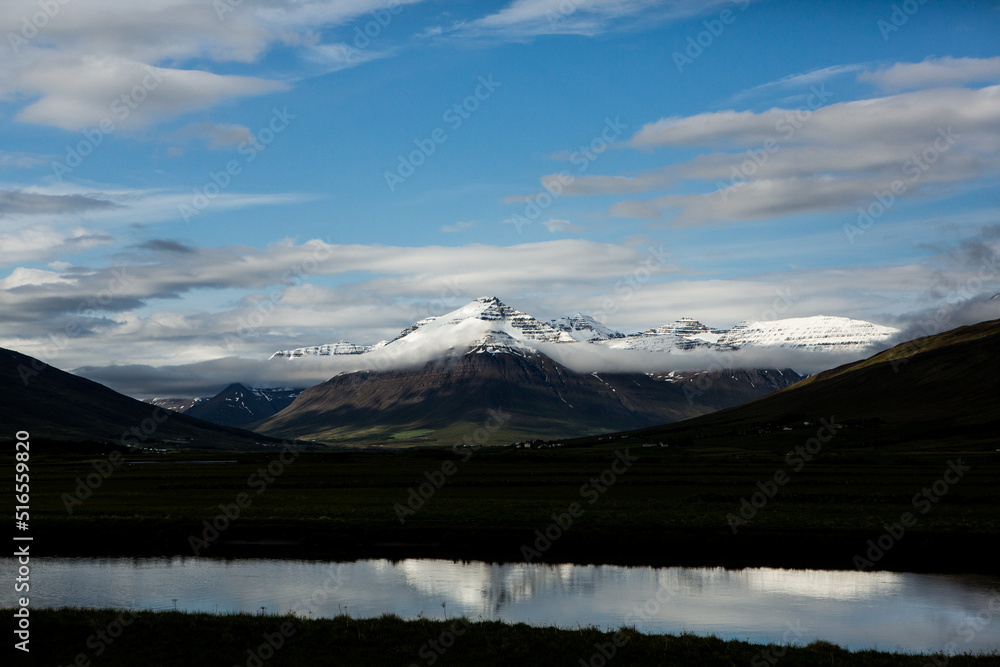 Naklejka premium Picturesque landscape with green nature in Iceland during summer. Image with a very quiet and innocent nature. 