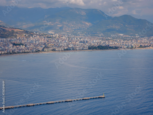 Alanya, turkey, winter walk by mediterranean sea. Ariel view of Alanya harbor from Alanya peninsula. Turkish Riviera by winter day. Beautiful cityscape. Turkish resort. photo