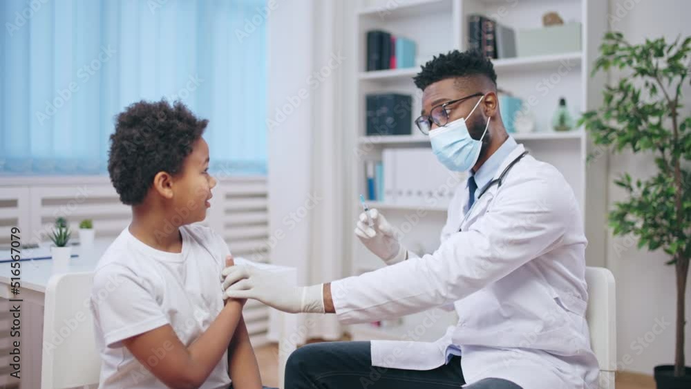 Little boy being afraid of injections at doctor's office, childhood immunization Little boy being afraid of injections at doctor's office, childhood immunization