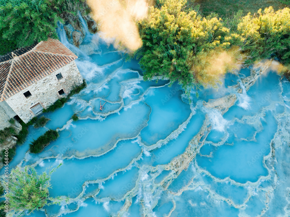 View from above, stunning aerial view of Le Cascate del Mulino, a group of beautiful hot springs in the municipality of Manciano, Tuscany.