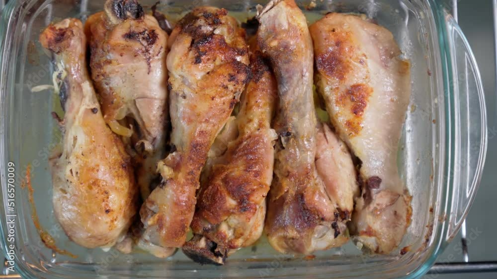 Golden chicken legs baked in the oven, crispy fried chicken, chicken cooking, close-up Golden chicken legs baked in the oven, crispy fried chicken, chicken cooking, close-up