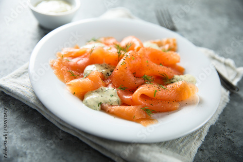 Traditional smoked salmon with dill sauce