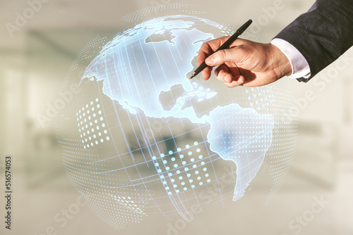 Double exposure of businessman hand with pen working with graphic America map on blurred office background, big data and digital technology concept