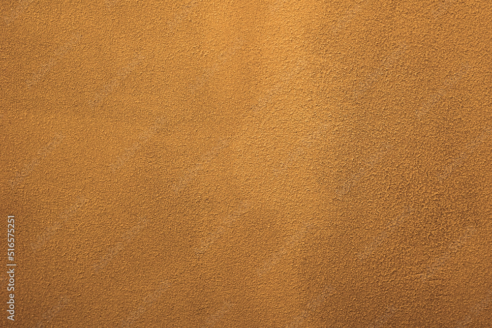 Light brown texture of a cement screed wall Light brown texture of a cement screed wall