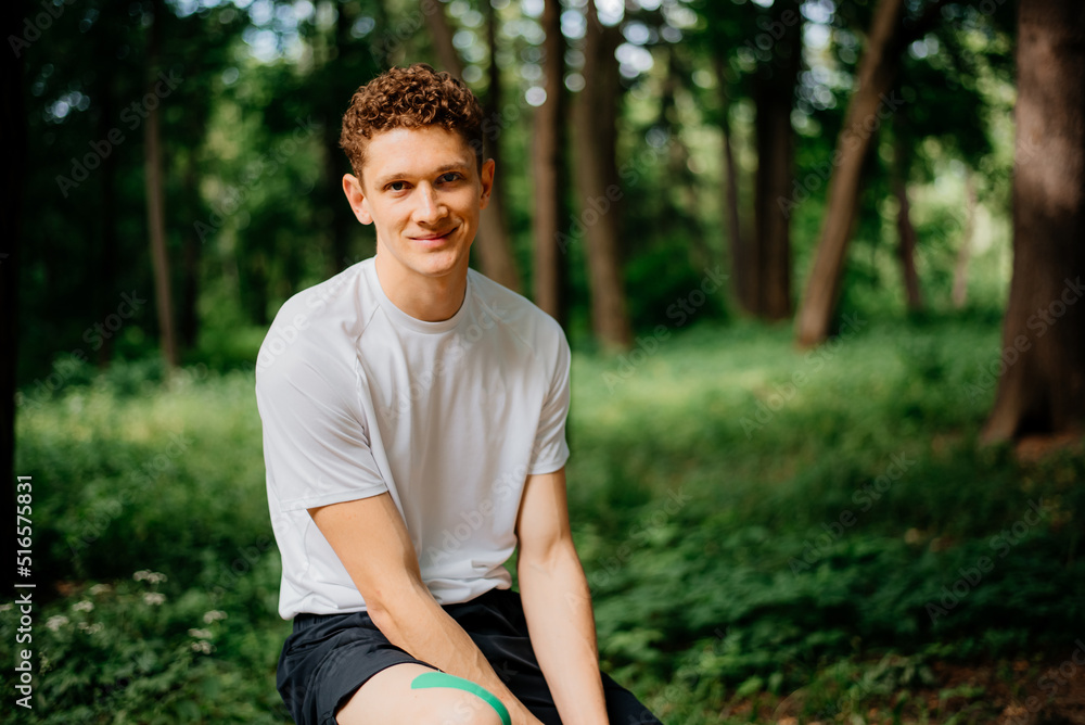 Sportsman resting after workout outdoors Sportsman resting after workout outdoors