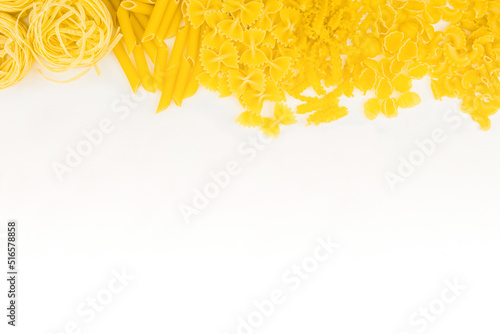 Different types of pasta on a white background. Raw macaroni.