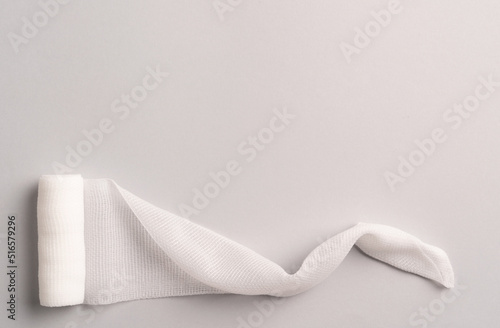 Photos First aid, injury protecting wrapping and wound dressing concept clean cotton gauze bandage isolated on colorful background with space for sign