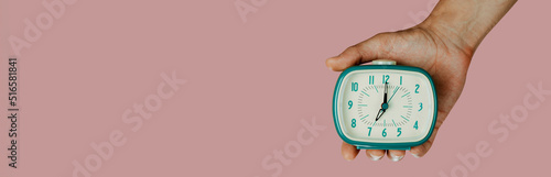 man with an alarm clock in his hand, web banner