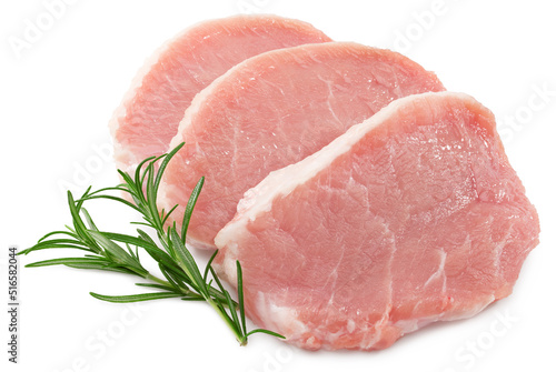 sliced raw pork meat with rosemar isolated on white background. Clipping path and full depth of field