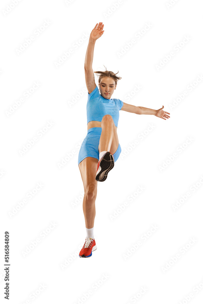 Triple jump technique. Studio shot of female athlete in sports uniform jumping isolated on white background. Concept of sport, action, motion, speed. Triple jump technique. Studio shot of female athlete in sports uniform jumping isolated on white background. Concept of sport, action, motion, speed.