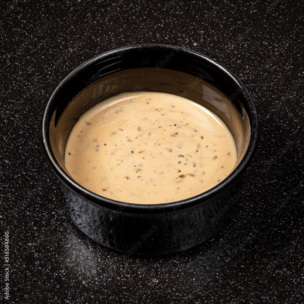 sesame sauce on the black background sesame sauce on the black background