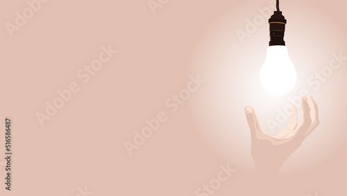 human hand holding burning lamp on beige background