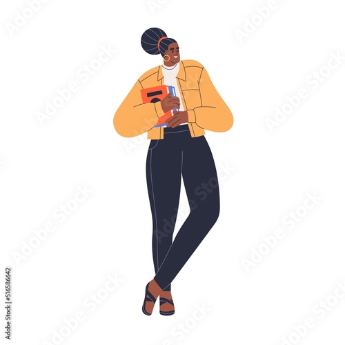 Young black woman holding books stack in hand. Happy girl with college litera...