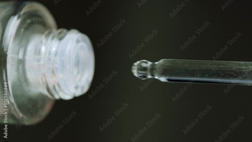 Glass bottle with micellar water in women's hands. Skin care and healthy care. Close-up. Glass bottle with micellar water in women's hands. Skin care and healthy care. Close-up.