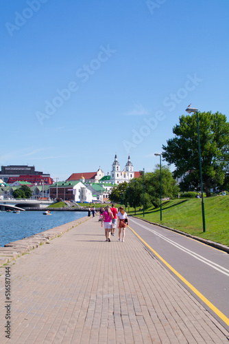 Minsk, Belarus - JUNE 24, 2022 : Vacationers on the Svisloch river in the center of Minsk . Traetskae Pradmestse or Trinity Suburb e historical center of Minsk.